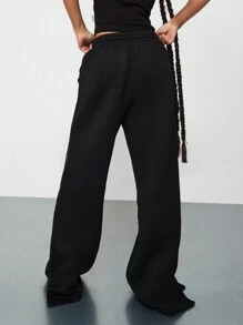 SUMWON WOMEN Straight Fit Sweatpants With Pintucks & Side Slit Leg Print Graphic - Black - View 2