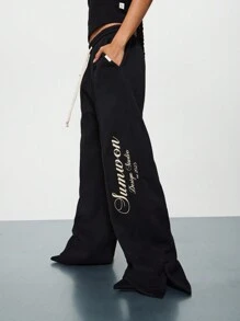 SUMWON WOMEN Straight Fit Sweatpants With Pintucks & Side Slit Leg Print Graphic - Black - View 1