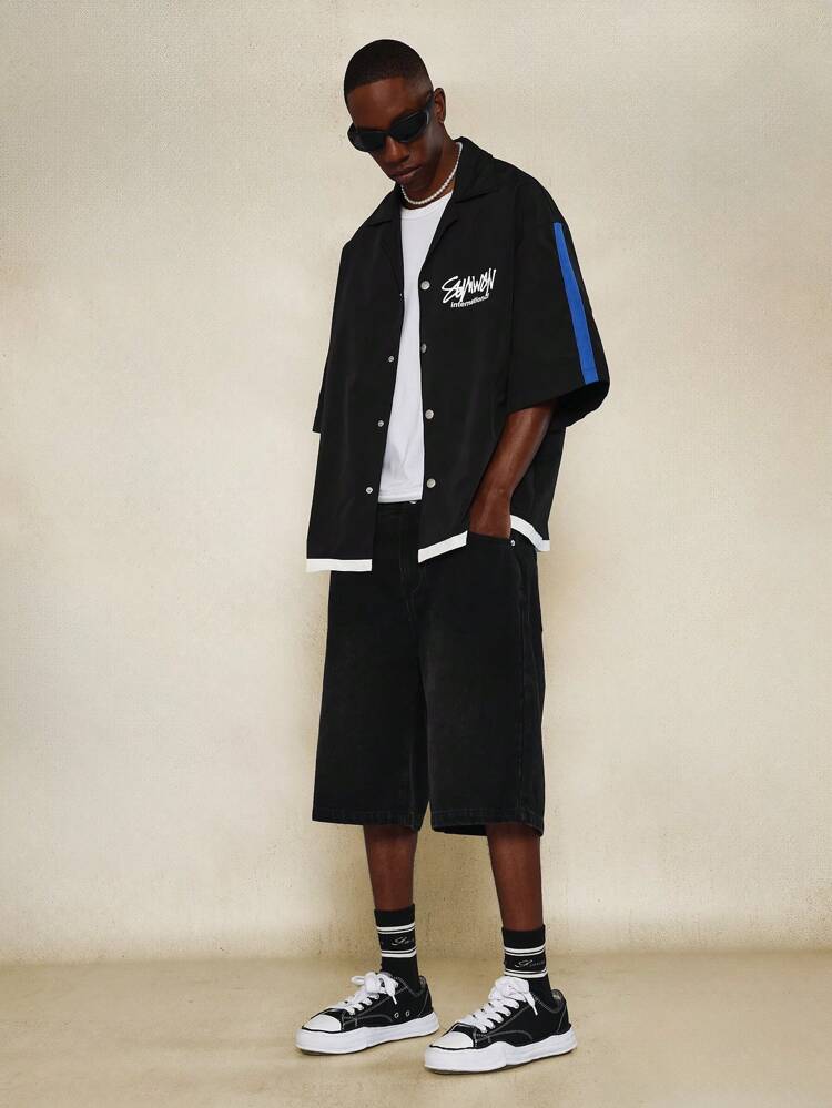 Chemise oversize à col châle avec imprimé contrasté sur les manches et petit imprimé graphique