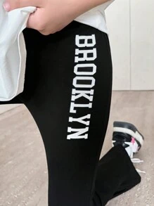 SHEIN 2 peças/Conjunto Camiseta de Manga Curta com Fenda Alta e Estampa de Letra e Legging Casual Solta para Meninas Pré-Adolescentes
