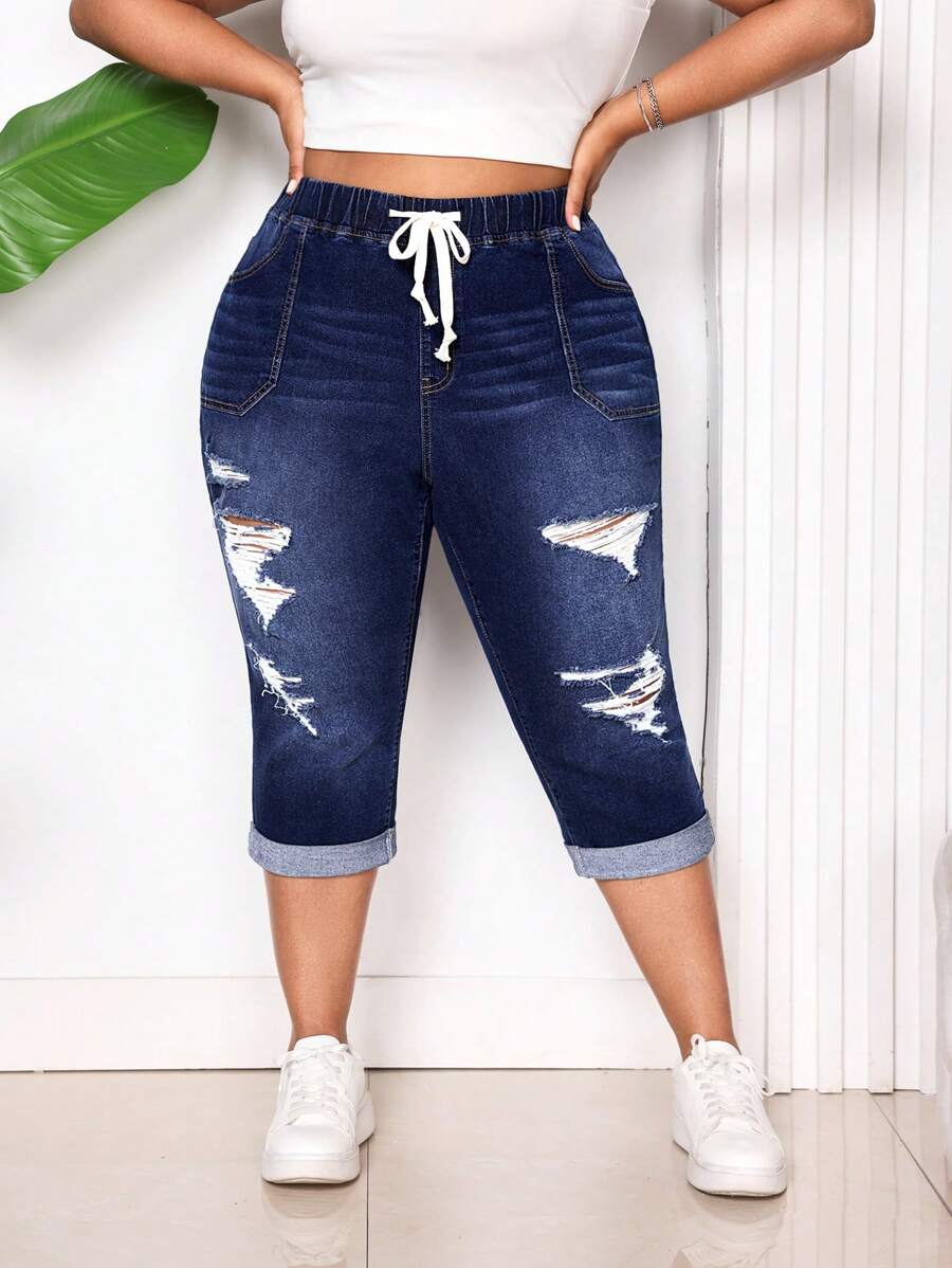 SHEIN CURVE+ Pantalones vaqueros elásticos pitillo azul desgastados de talla grande para mujer
