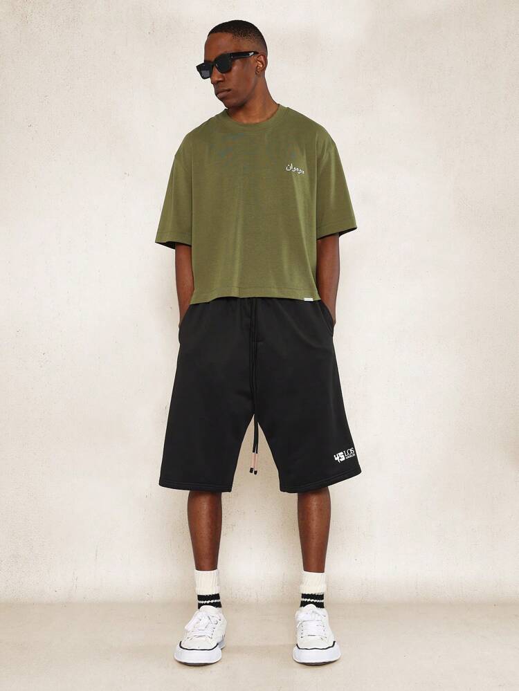 Conjunto de 2 piezas con camiseta ajustada corta con estampado gráfico árabe y pantalón corto plisado