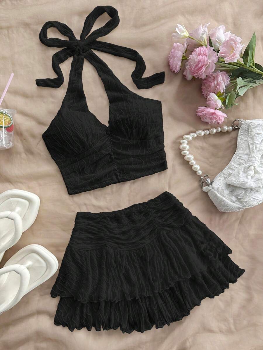 Soleia Bộ 2 trang phục đi nghỉ giản dị lãng mạn dành cho nữ: Áo hai dây hở lưng cổ chữ V co giãn có họa tiết & chân váy xếp ly - màu đen - Xem 1