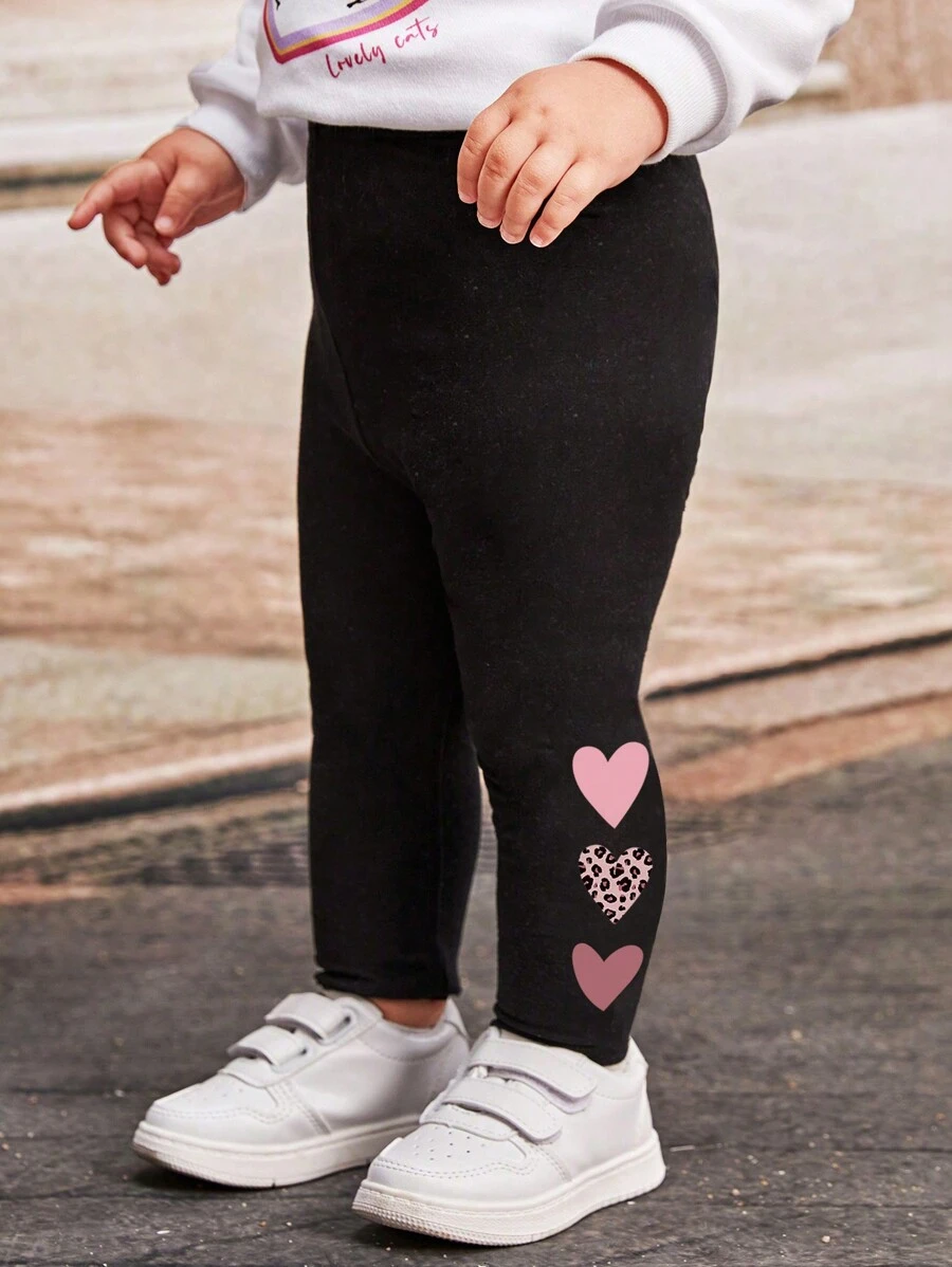 SHEIN Baby Girl Casual Cute Cartoon Heart & Leopard Print Pattern Leggings, Versatile Black Cotton Blend Pants Suitable For Spring/Summer