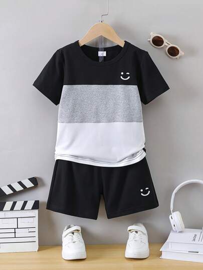 SHEIN Explorewe 2 piezas/set Camiseta de manga corta y pantalones cortos con estampado de cara guiñando para niño joven, en negro, blanco y gris, verano