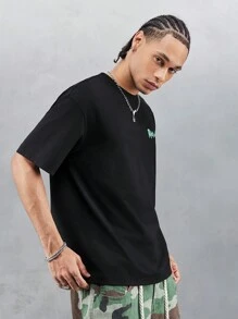 Rick and Morty X SHEIN Camiseta de manga corta holgada con estampado de personaje de dibujos animados y letras, de hombros caídos, casual, de verano para hombre