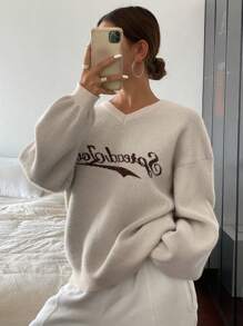 DAZY Suéter holgado de manga larga con cuello en V y estampado jacquard de letra para mujeres