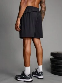 Manfinity Sport Corelite Herren Freundin Stil Shorts mit elastischem Bund, geometrischem Muster und Taschen, Lässig Fitness Shorts