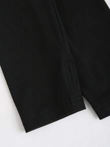 Flirla Mono negro de cuello alto con abertura, ceñido y con vuelo