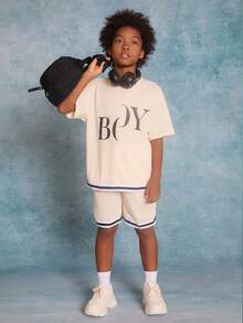 SHEIN Tween Boys' Knitted Solid Color Letter Printed Patchwork Woven Tape Short Sleeve T-Shirt And Shorts Set - Beige - View 2