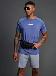 Manfinity Sport Polished Conjunto de camiseta de cuello redondo y manga raglán con estampado de letras y shorts holgados de estilo de novio, ropa deportiva y de gimnasio