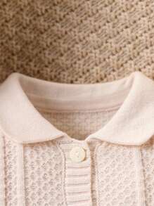 Mono de punto de moda y lindo todo a juego para niña bebé, mono de una sola pieza de manga larga blanco con diseño simple pero elegante con decoración de lazo negro en el pecho