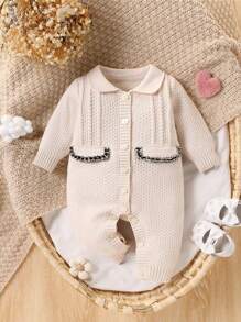 Mono de punto de moda y lindo todo a juego para niña bebé, mono de una sola pieza de manga larga blanco con diseño simple pero elegante con decoración de lazo negro en el pecho