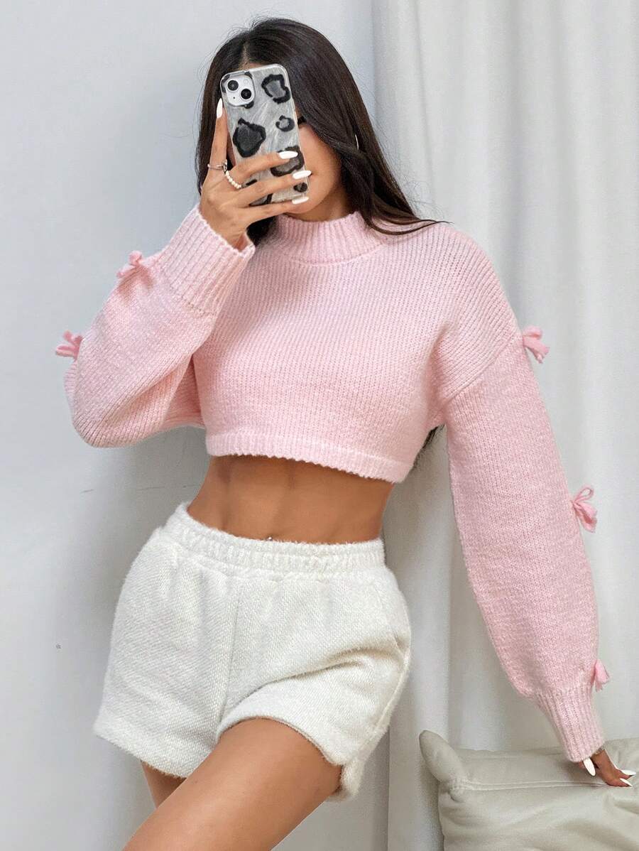 Flirla Áo len nữ cổ tròn tay dài thắt nơ phía trước, kiểu dáng đơn giản, chất liệu trơn, thích hợp mặc mùa thu đông. - Màu Hồng baby - Xem 1
