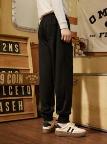 Manfinity Sport Corelite Pantaloni de trening casual relaxați pentru bărbați, stil boyfriend, cu buzunar cu imprimeu cu litere