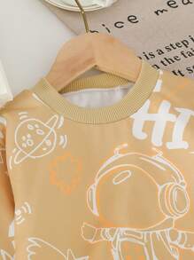 SHEIN 2-częściowy zestaw bluzy z grafiką astronauty i spodni dresowych z prążkowanej dzianiny, odpowiedni dla chłopców w wieku 4-7 lat na jesień, wiosnę i zimę - Kolor khaki - Zobacz 3