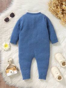 Pagliaccetto in maglia semplice con stampa floreale, con bottoni sul davanti e bordo a conchiglia, maniche corte, per bambina