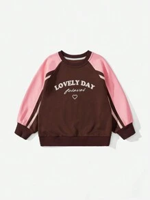 SHEIN Ropa casual de estilo al aire libre para niñas pequeñas en otoño, sudadera con bloques de color, mangas de contraste y estampados gráficos, adecuada para juegos al aire libre y uso casual diario en la ciudad