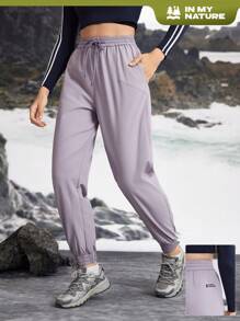 In My Nature Women's Solid Color Drawstring Pocket Relaxed Fit Outdoor Sports Pants & Joggers - Purple - View 1