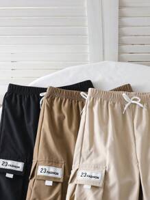 SHEIN Young Boy Casual Front Tie Pocket Solid Color Pants, Everyday Wear