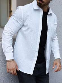 Manfinity Homme Camisa casual de manga larga de botones de un solo color con bolsillo para hombres