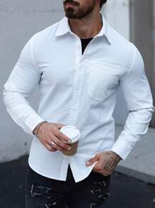 Manfinity Homme Camisa casual de manga larga de botones de un solo color con bolsillo para hombres