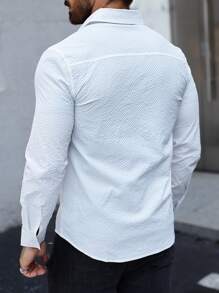 Manfinity Homme Camisa casual de manga larga de botones de un solo color con bolsillo para hombres
