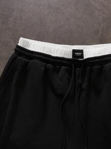 Manfinity VCAY Pantalones de chándal largos de punto con doble cintura, color negro y blanco para hombre