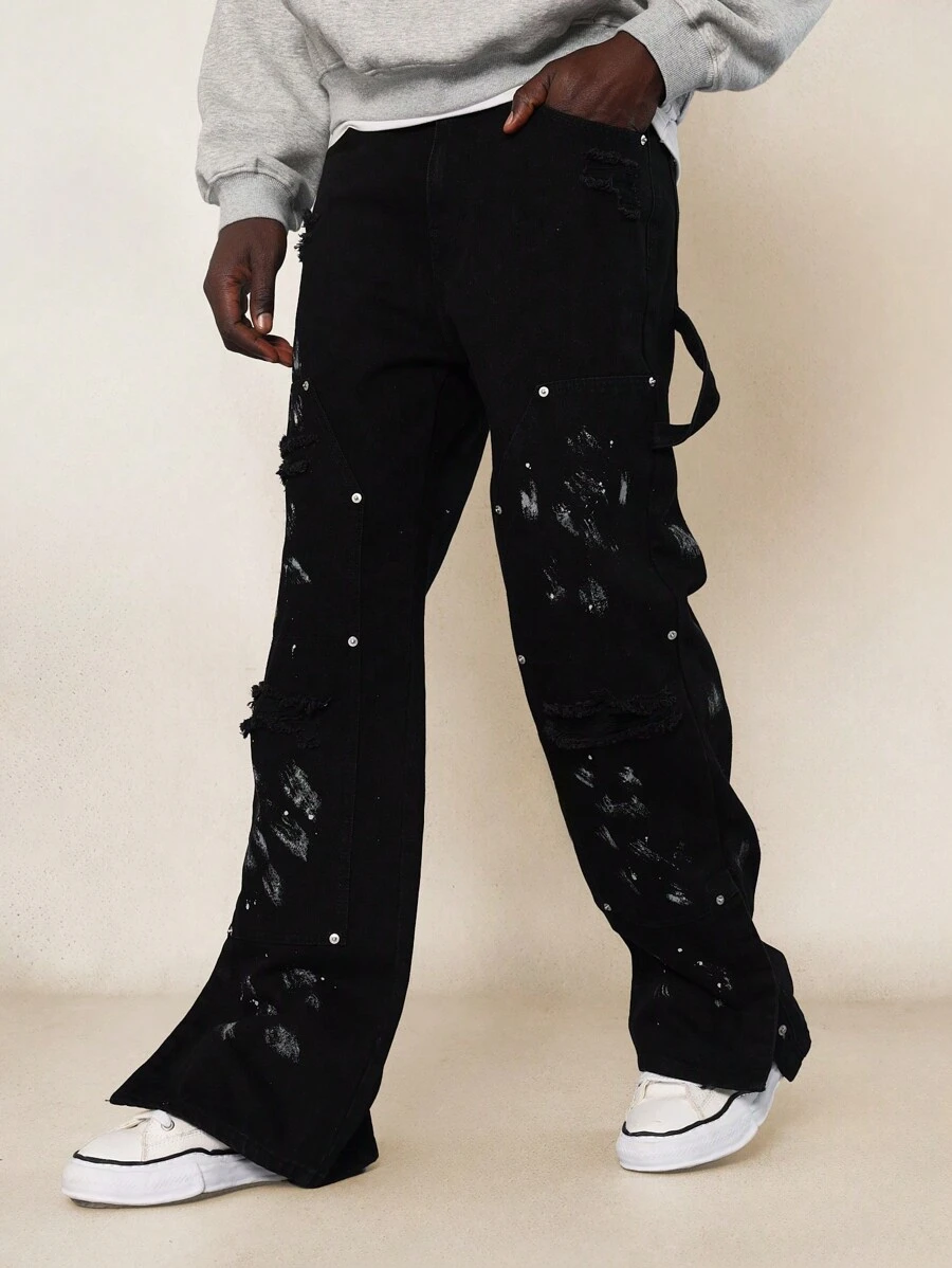 SUMWON Pantalón de mezclilla de carpintero con ajuste acampanado y desgastado, con botones a presión laterales y salpicaduras de pintura - Negro - Ver 1