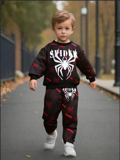 SHEIN Młody chłopiec modny swobodny zestaw bluzy z nadrukiem pająka i spodni dresowych, odpowiedni na występ na imprezie Halloween, kostium na Halloween