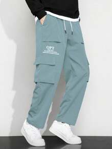 Manfinity Hypemode Men Loose Fit Slogan Graphic Flap Pocket Side Drawstring Waist Cargo Pants - Teal Blue - View 1