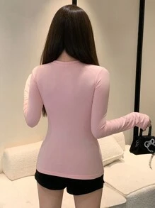 DAZY Damen Langarm T-Shirt mit Schleifendekor und Buchstabendruck, figurbetont, Pullover im Preppy-Stil mit Grafik-Motiv für den Herbst