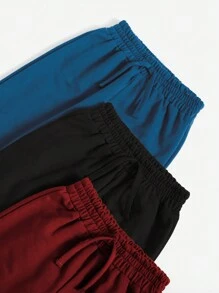 SHEIN Set de 3 pantalones jogger casuales de color liso y con nudo para niño