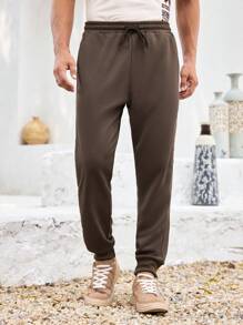 Manfinity Homme Męskie brązowe, patchworkowe, ściągane sznurkiem spodnie dresowe na co dzień