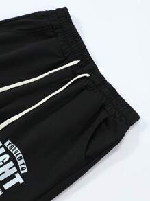 Manfinity Sport PWRUP Short de sport pour homme style boyfriend avec cordon de serrage à la taille et imprimé slogan