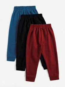 SHEIN Set de 3 pantalones jogger casuales de color liso y con nudo para niño