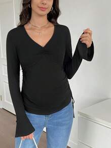 SHEIN Camiseta de maternidad informal de color negro de manga abullonada larga - Negro - Ver 1