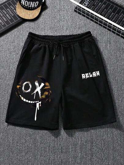 Shorts à cordon de serrage à la taille avec motifs de dessins animés et lettres pour hommes