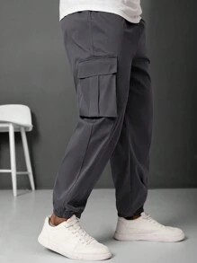 Manfinity LEGND Pantalones jogger informales para hombre talla grande con parche con letra y bolsillo cargo