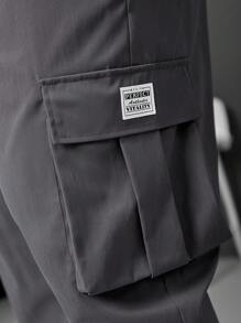 Manfinity LEGND Pantalones jogger informales para hombre talla grande con parche con letra y bolsillo cargo