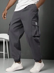 Manfinity LEGND Pantalones jogger informales para hombre talla grande con parche con letra y bolsillo cargo