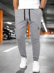 Manfinity Homme Pantalones deportivos casuales para hombre con cordón y bolsillos, unicolor