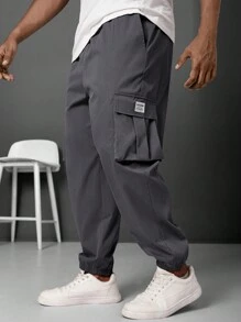 Manfinity LEGND Pantalones jogger informales para hombre talla grande con parche con letra y bolsillo cargo
