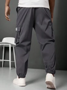Manfinity LEGND Pantalones jogger informales para hombre talla grande con parche con letra y bolsillo cargo