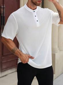 Manfinity Homme Camisa polo casual de manga corta con botones delanteros de unicolor talla grande para hombre