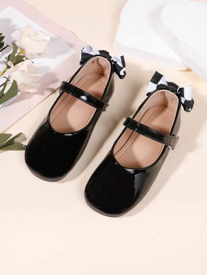 1 双女孩黑色优雅蝴蝶结装饰休闲平底鞋