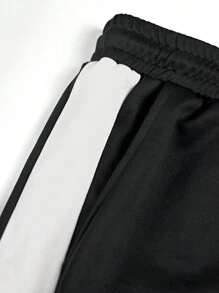 Manfinity LEGND 2 piezas Chándal casual de talla grande para hombres con sudadera de cuello redondo con estampado de letras en contraste y pantalón de chándal con bolsillo con cordón