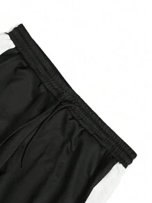 Manfinity LEGND 2 piezas Chándal casual de talla grande para hombres con sudadera de cuello redondo con estampado de letras en contraste y pantalón de chándal con bolsillo con cordón