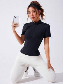 SHEIN Sport Studio Camisa tipo polo deportiva de mujer con media cartera con cremallera y manga corta de unicolor