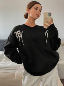 DAZY Sudadera holgada con cuello en V, mangas largas, estampado numérico y bloques de color con lazo para mujer, ropa de mujer para otoño - Negro - Ver 1